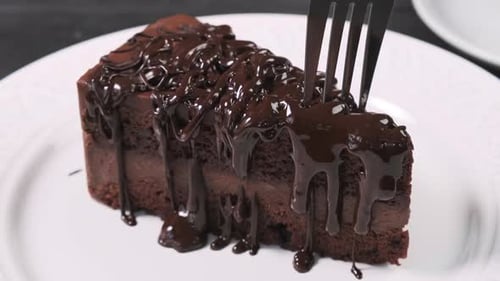Chocolate Cake Slice Eaten with Fork Close Up