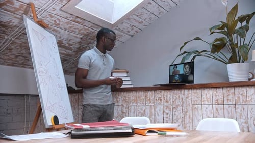 Man Giving Presentation on Video Call From Home