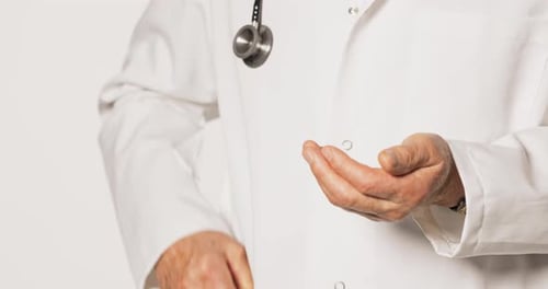 Adult Doctor Using Hand Sanitizer for Cleanliness