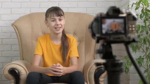 Young blogger makes video.