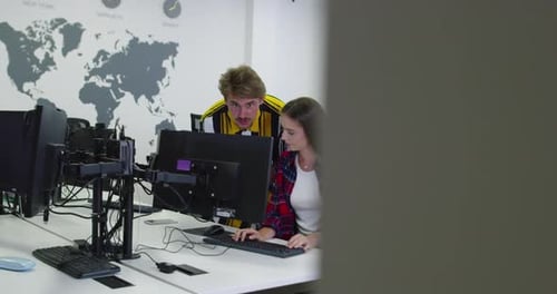 Concentrated Male Businessman Looking at Computer Monitor Working at Startup Office