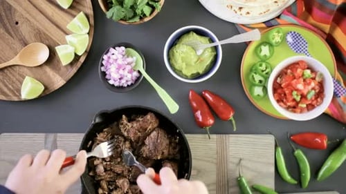 Taco Ingredients on Table, Meat Being Shredded
