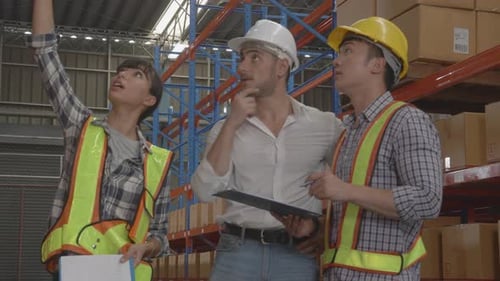 Warehouse Workers Discuss Inventory Strategy