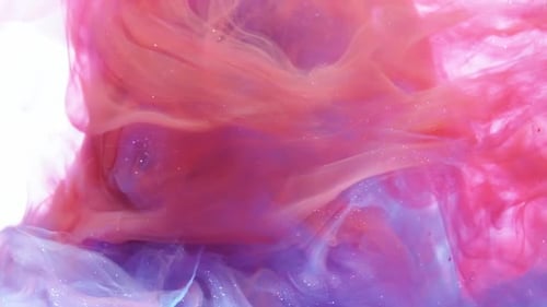 Blue and Red Ink Mixing in Water on White Background, Slow Motion.