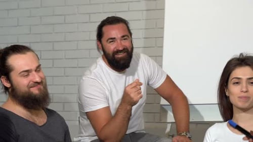 Team Congratulates Colleague at Workplace Presentation