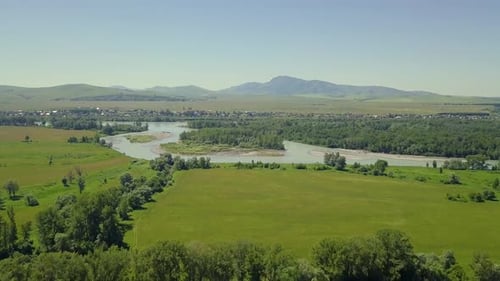 Aerial: Flying Over the Highlands. View of the Islands of the Mountain River, Tourist Town