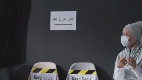 People Wearing Masks Waiting for Job Interviews