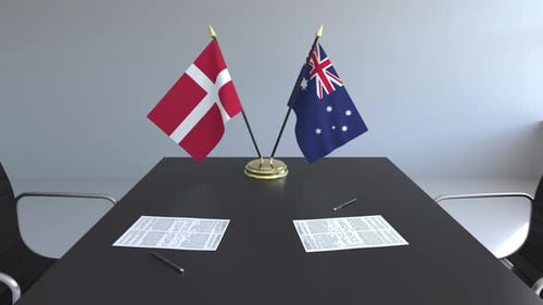 Denmark and Australia Flags on Conference Table Animation