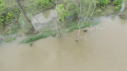Flooded River Overflows Lush Green Banks