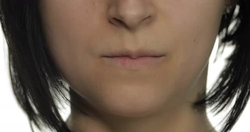 Woman Takes Pill and Drinks Glass of Water