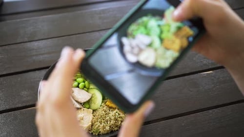 Female Hands Make Video of Lunch Bowl By Phone in Cafe