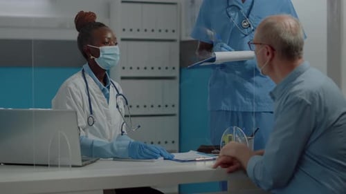 Doctor Consults Patient in Modern Medical Office