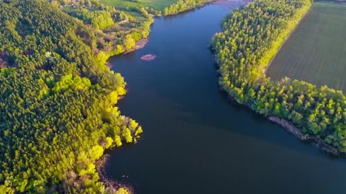 Flying Over the Beautiful Spring River. Aerial Camera Shot. Ukraine.