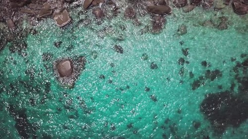 Sea Surface Ripple at Sunlight with Transparent Clear Water and Visible Sandy Bottom with Underwater