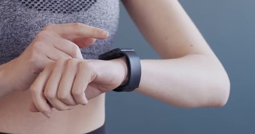 Woman Interacting with Smart Watch Device Close Up
