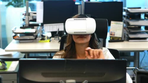 Woman Using Virtual Reality Headset in Modern Office