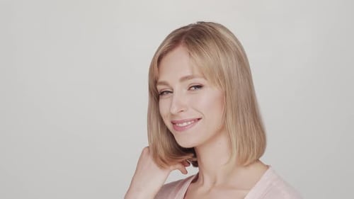 Studio portrait of young, beautiful and natural blond woman.