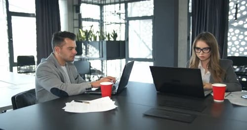 Colleagues Working in Office