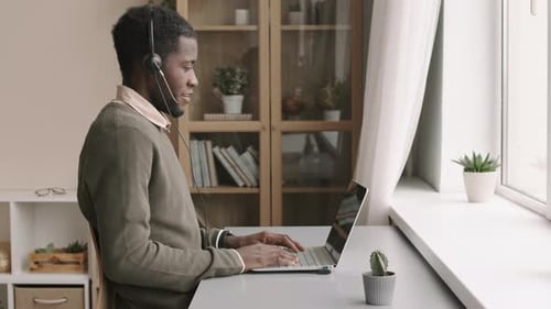 Man Waving During an Online Meeting