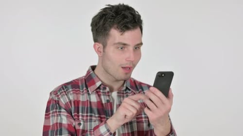 Man Celebrates Good News on Smartphone