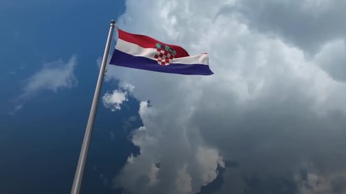 Waving Flag of Croatia on Pole Against Cloudy Sky