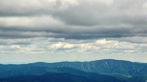 Mountain Range Landscape Underneath Cloudy Sky