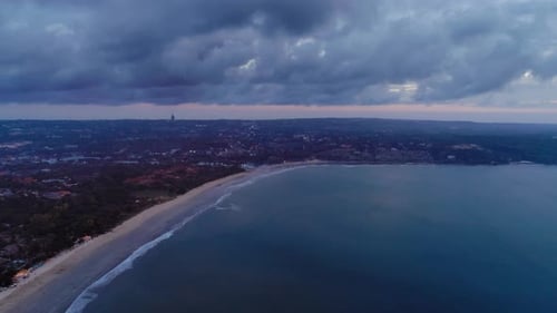 Aerial View Of The Ocean Coast Under Dramatic Clouds
