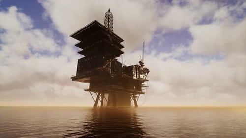 Offshore Jack Up Rig mitten im Meer bei Sonnenuntergang