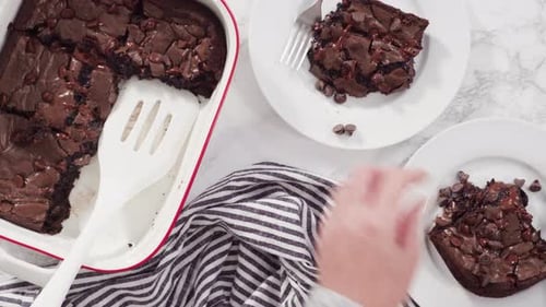 Overhead Shot of Tasty Chocolate Brownies Being Decorated