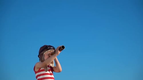 Curious Child Exploring Sky With Telescope Outdoors