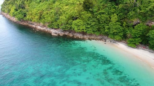 Green island with sea beach from aerial view. Tropical nature