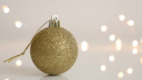 Golden Christmas Ball Ornament with Sparkling Lights