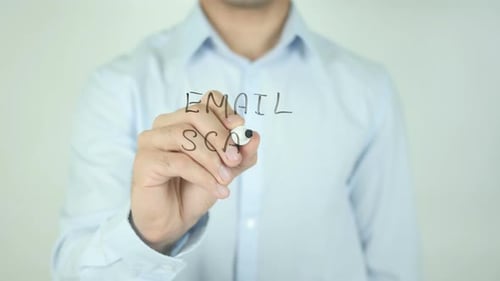 Adult Writes Email Scam On Clear Surface