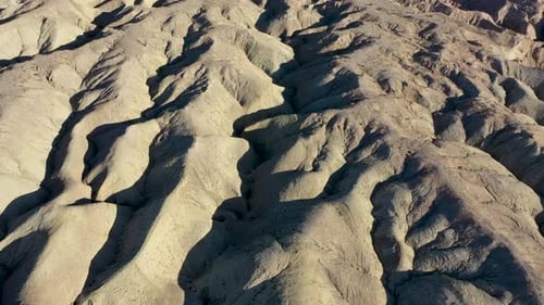 Aerial top down shot of hilly dried mud landscape during heat in California,Usa - Anza-Borrego Deser