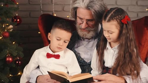 Grandfather Reads Christmas Story with Children