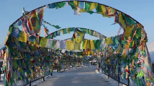 Colorful Prayer Flags on Snowy Mountain Path