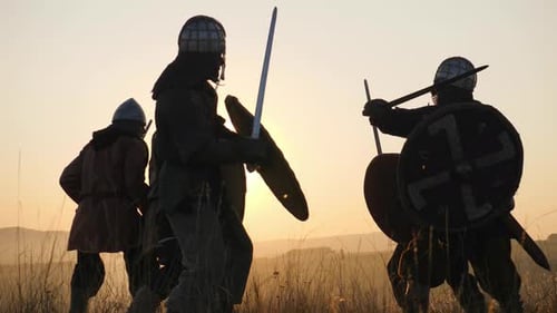 Armored Warriors Clash in Sunset Battle Scene