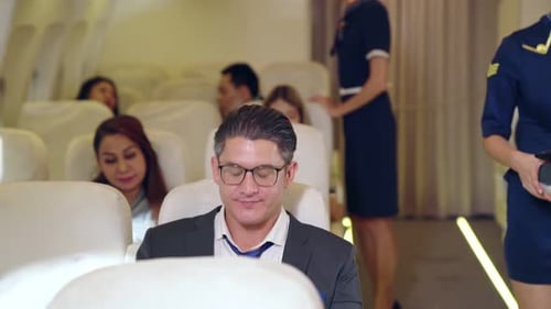 Flight Attendant Offering Pillow to Cheerful Passenger