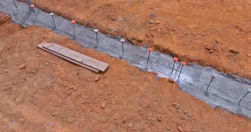 Providing Reinforcement to a Reinforced Concrete Structure Through a Strip Foundation Frame