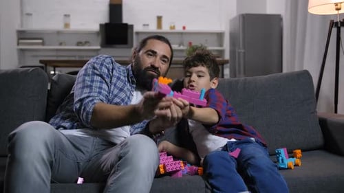 Father and Son Building Blocks on Couch