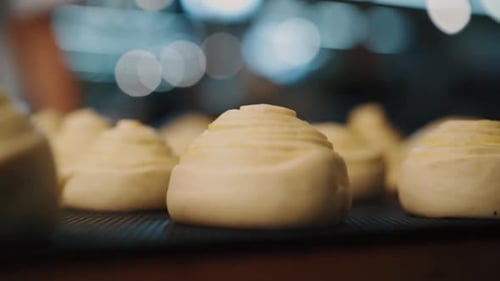 Unbaked Dough Pastries on Baking Sheet