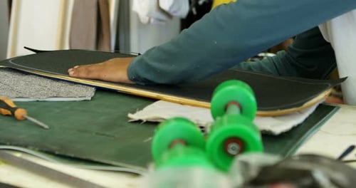 Skateboard Assembly on Green Work Surface