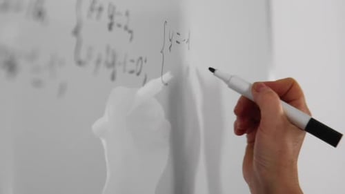 Hand Writing Math Equations on White Board