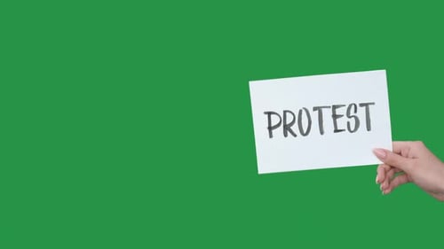 Hand Holding Protest Sign on Green Screen