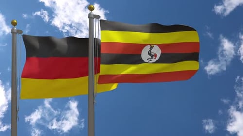 Germany and Uganda Flags Waving in Bright Sky