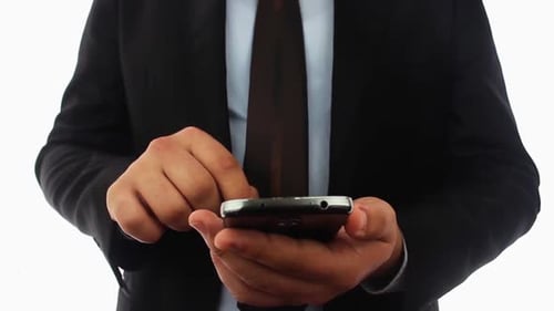 Man in Suit Using Mobile Phone