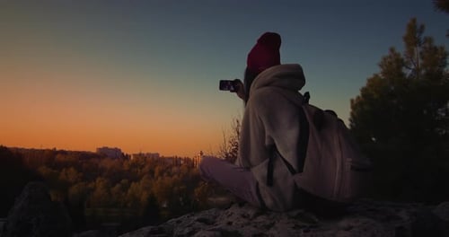 Young Female A Cliff At Sunset. Selfie