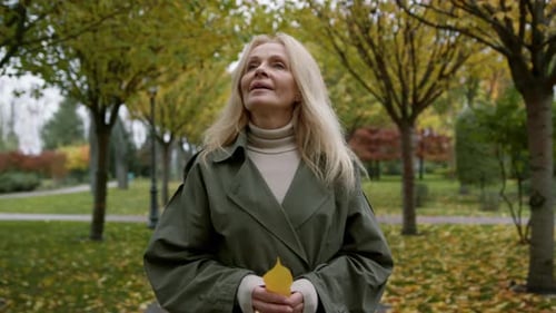 Portrait of Beautiful Woman Walking in Autumn Park