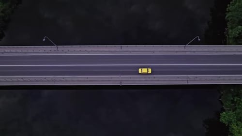 Top Aerial View to the Car on the Old Bridge Over the River