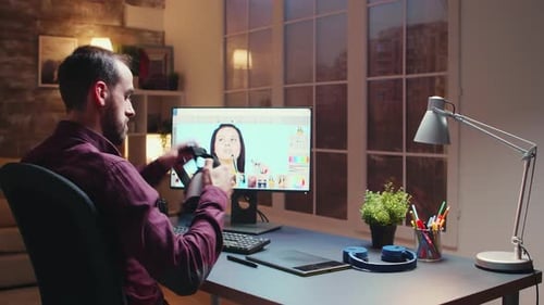 Freelancer Photographer Works on Photos Using Modern Retouching Software